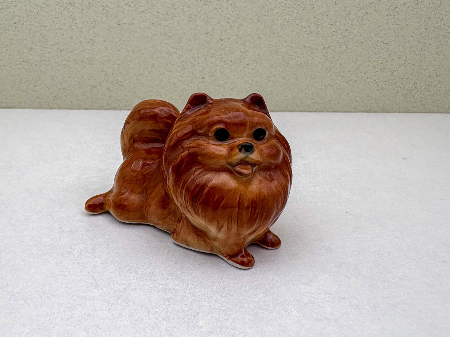 Ceramic Reddish-Brown Pomeranian Figurine Trio – Adorable Dog Statues in Standing, Sitting and Laying Poses, Perfect for Home Décor
