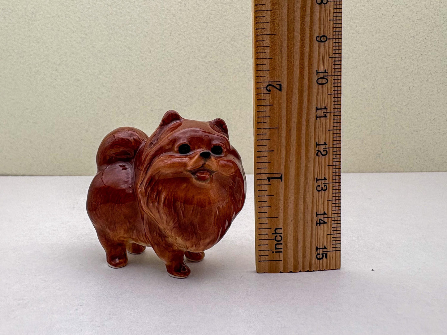 Ceramic Reddish-Brown Pomeranian Figurine Trio – Adorable Dog Statues in Standing, Sitting and Laying Poses, Perfect for Home Décor