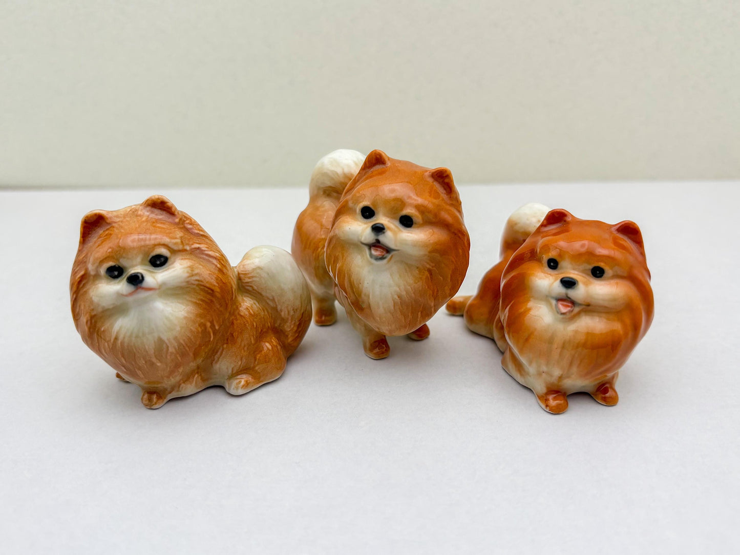 Orange Pomeranian Ceramic Dog Figurines Trio – Hand-Painted Miniatures for Animal Lovers, Cute Gifts, or Home & Office Decoration