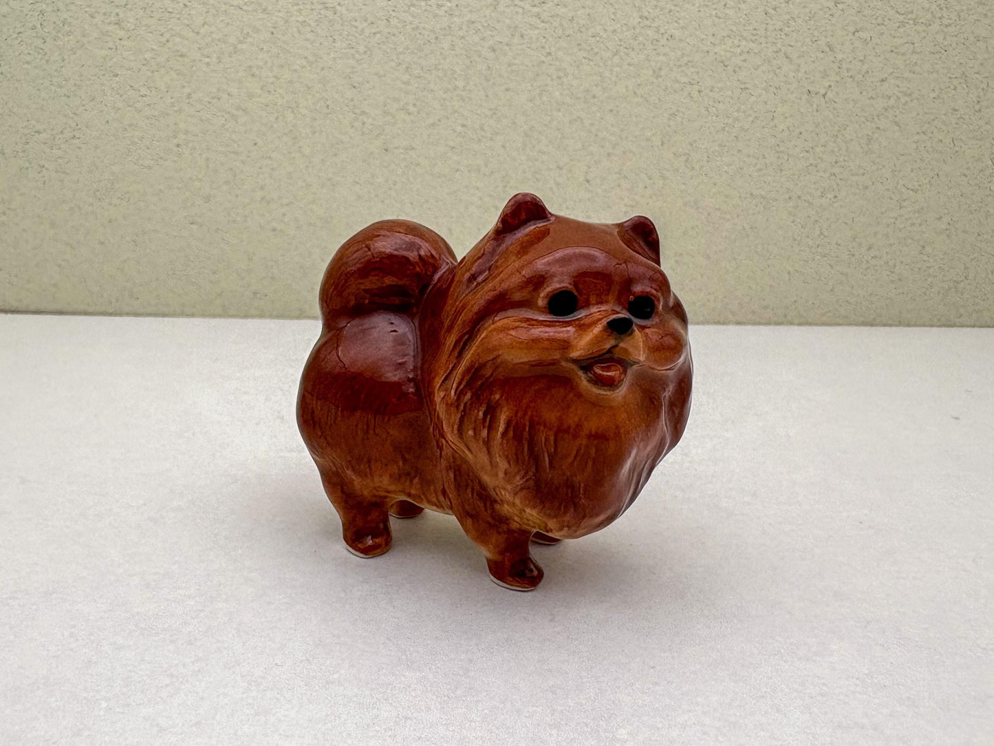Ceramic Reddish-Brown Pomeranian Figurine Trio – Adorable Dog Statues in Standing, Sitting and Laying Poses, Perfect for Home Décor