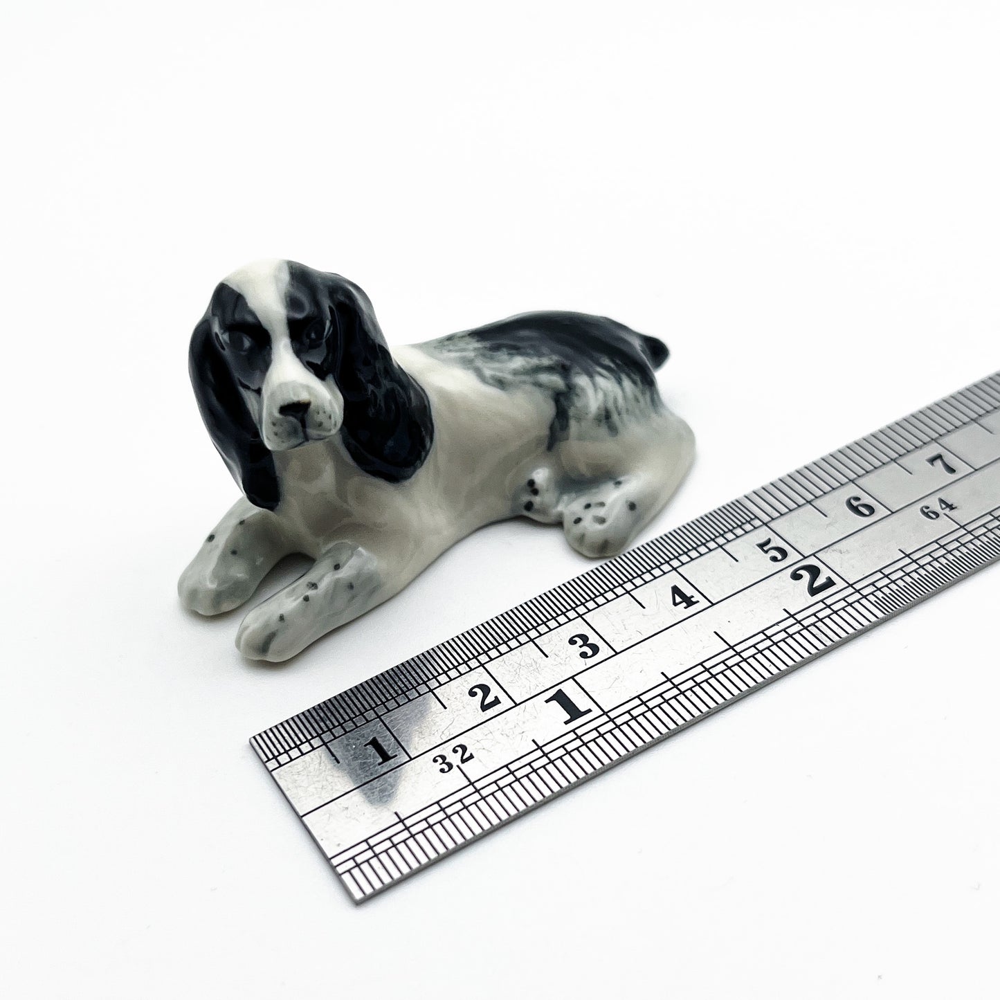 2 White and Black Cocker Spaniel Dogs