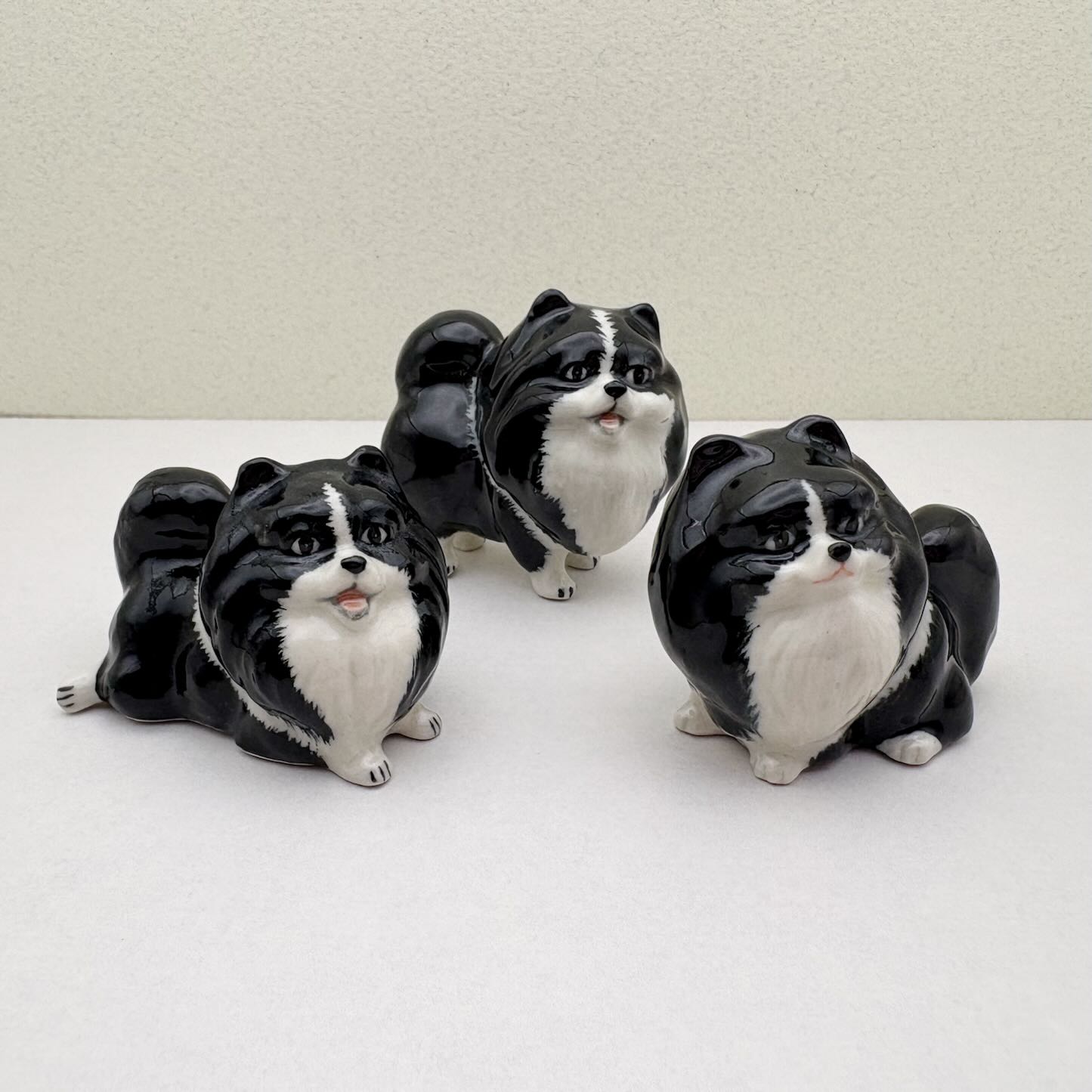 Ceramic Pomeranian Figurine Set – Trio of Black-and-White Dog Collectibles with Glossy Finish, Great Gift for Pet and Figurine Lovers