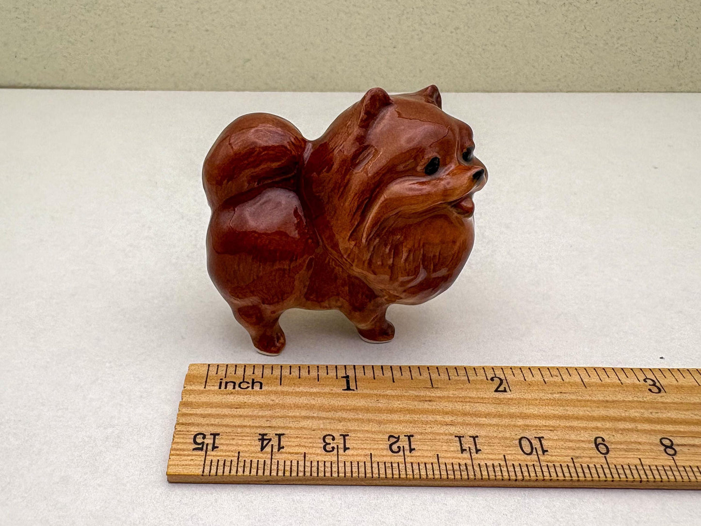 Ceramic Reddish-Brown Pomeranian Figurine Trio – Adorable Dog Statues in Standing, Sitting and Laying Poses, Perfect for Home Décor