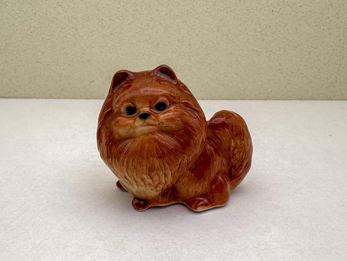 Ceramic Reddish-Brown Pomeranian Figurine Trio – Adorable Dog Statues in Standing, Sitting and Laying Poses, Perfect for Home Décor