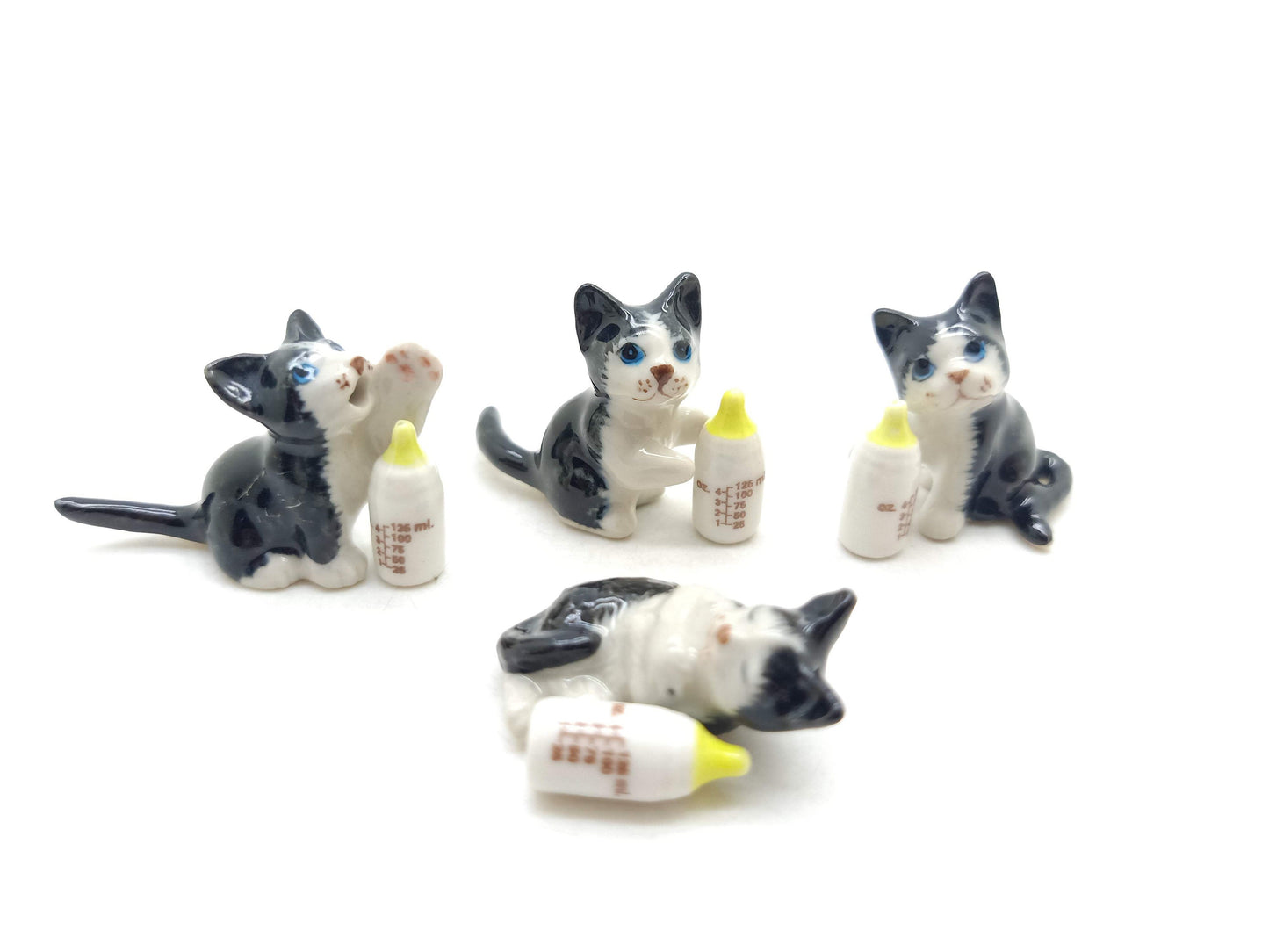4 Kitten Cats with Milk Bottles