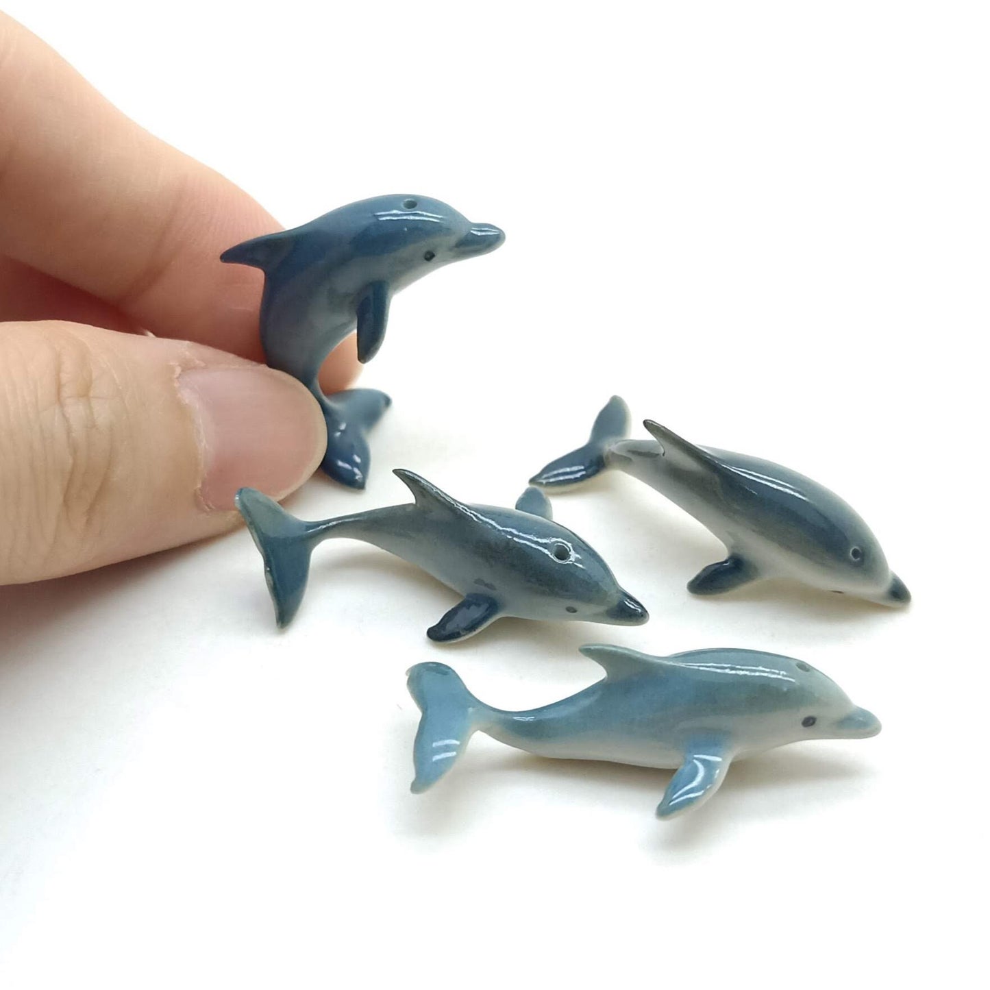 4 Tiny Thin Dolphins