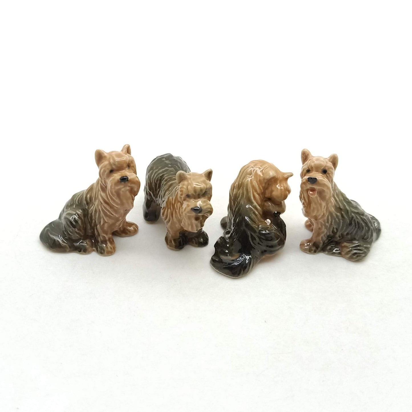 4 Yorkshire Terrier Figurines