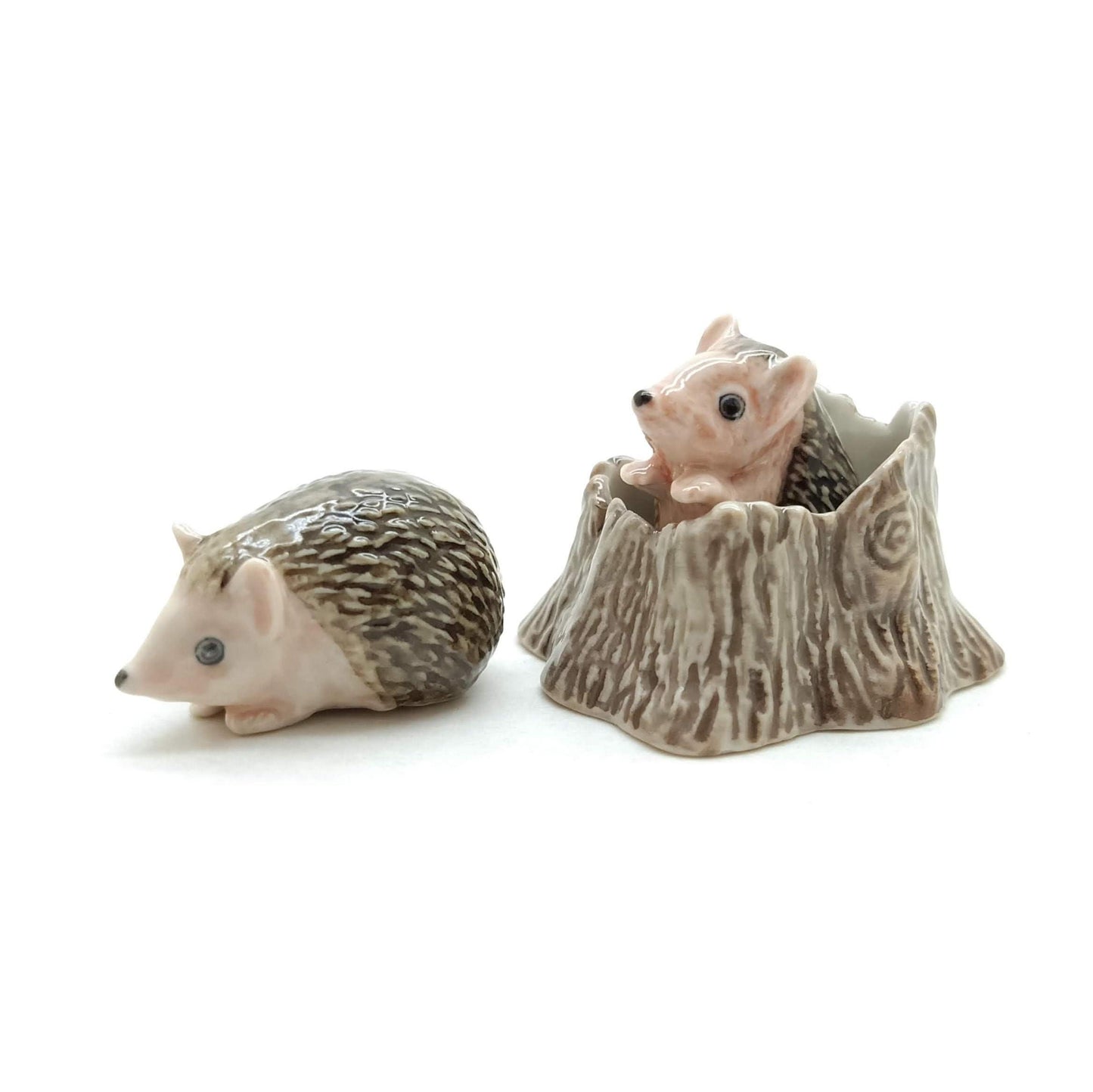 2 Hedgehog Porcupines with Tree Trunk
