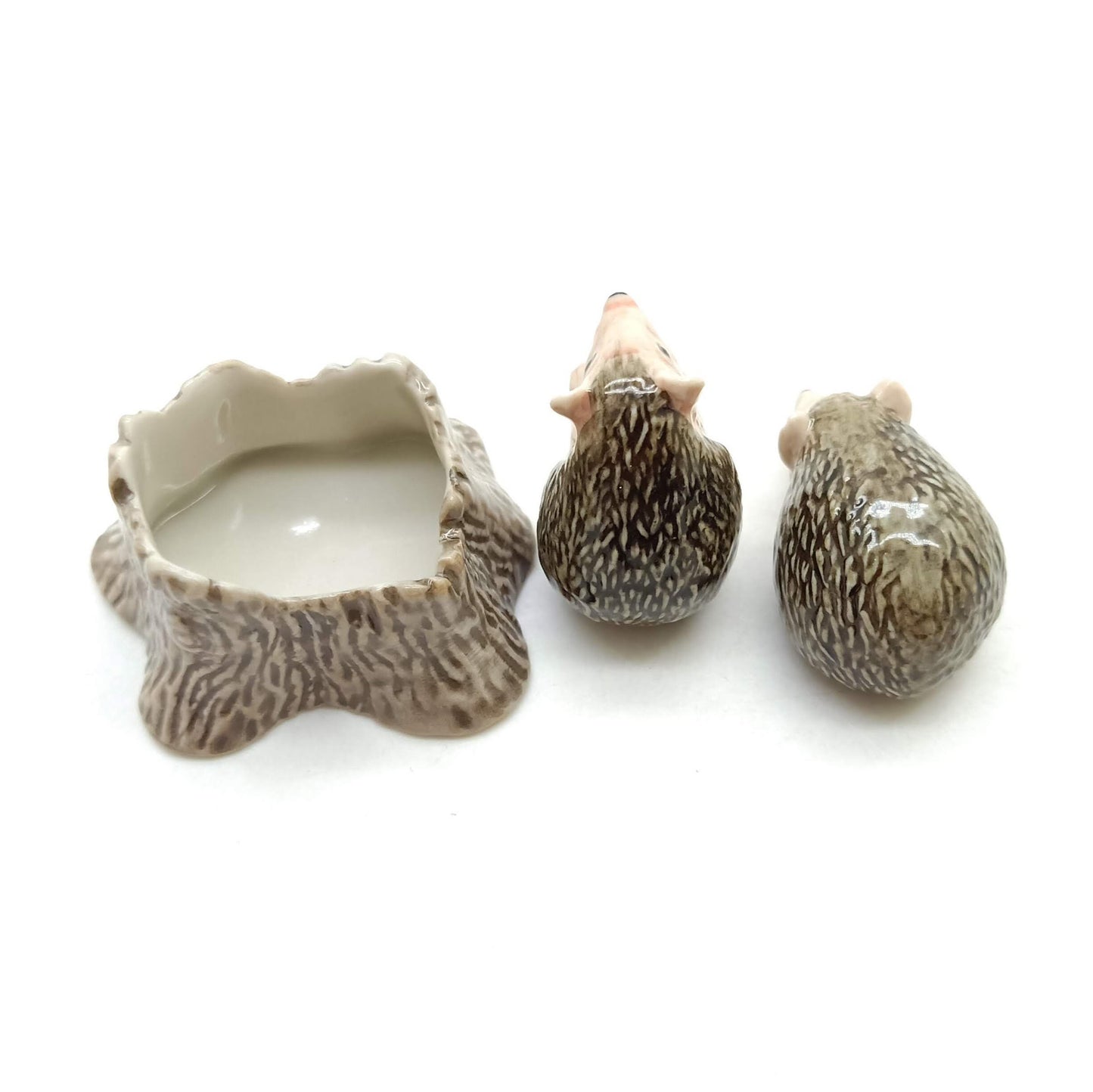 2 Hedgehog Porcupines with Tree Trunk