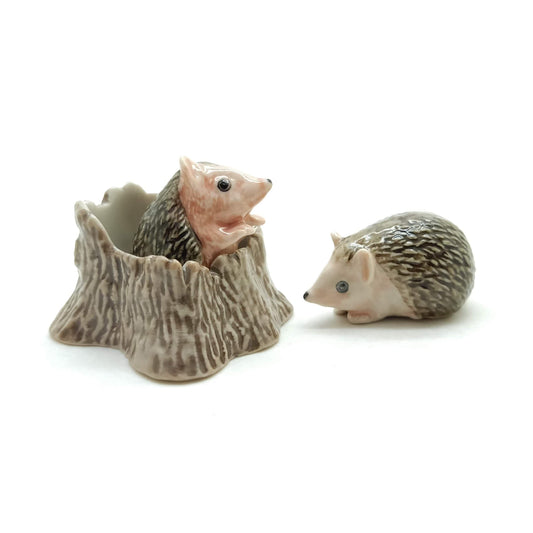 2 Hedgehog Porcupines with Tree Trunk