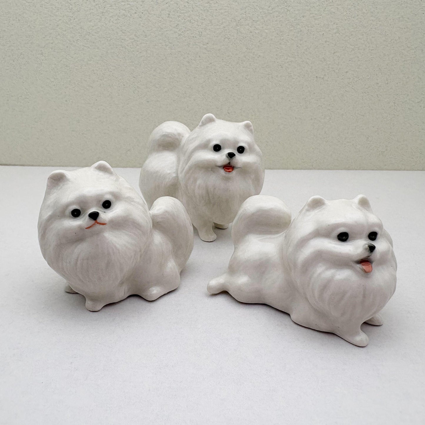 Charming White Ceramic Pomeranian Figurine Set, Trio of Lifelike Dog Figurines in Unique Poses, Ideal for Pet Lovers, Home Decor Enthusiasts