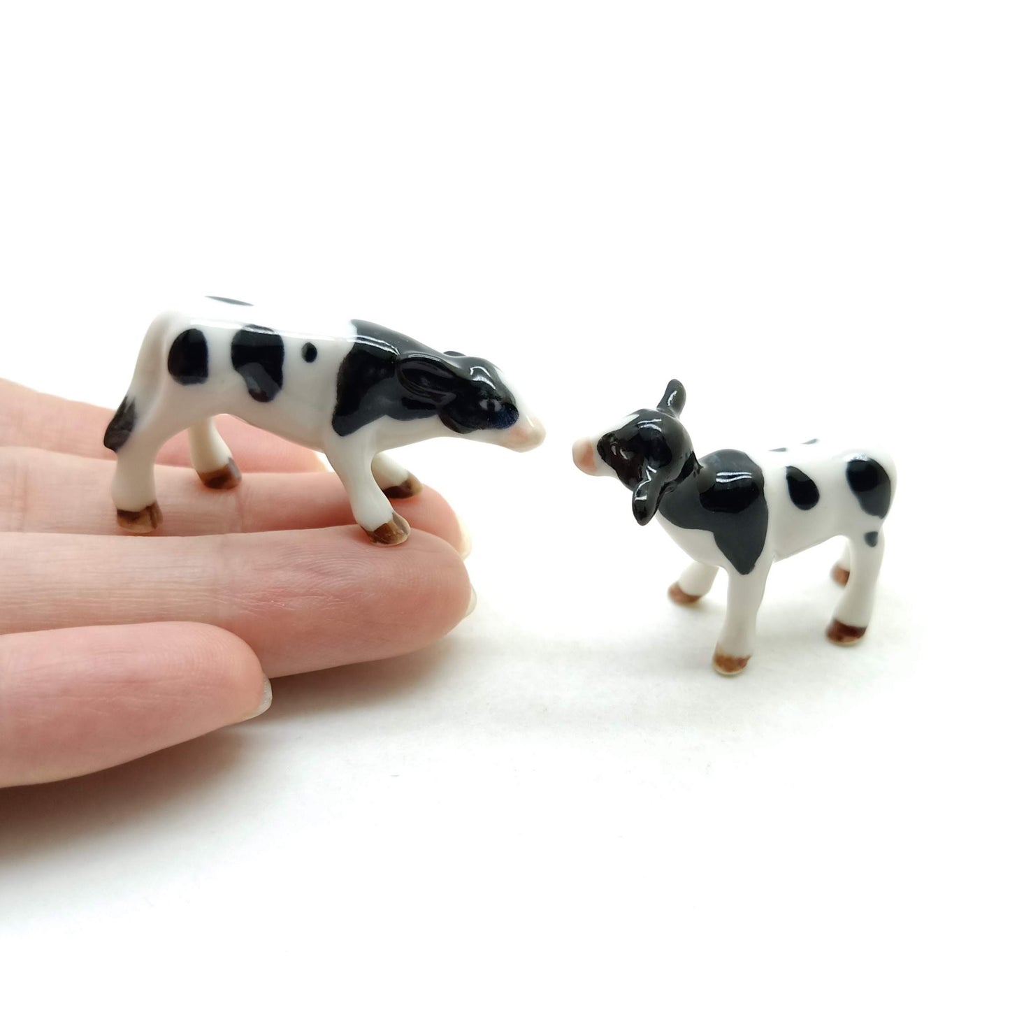 Set of 2 Cow Ceramic Figurine animal Miniature White and Black Statue